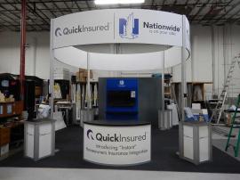 RENTAL: Island Design with (4) Curved Headers and Double-Sided Kiosk with (2) 55" Monitors