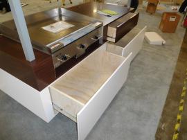 Custom Grilling Demonstration Station with Mirrored Ceiling and Storage Drawers