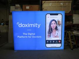 Modified ECO-1066-D Sustainable Exhibit with Backlit Fabric Graphics, Monitor Mount, and Eco-Glass Plex Infills