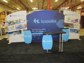 Modified SYK-2007 Symphony Portable Display with SEG Fabric and Direct Print Graphics, (2) Backwall Workstations, (1) SYM-403 Counter, Literature Trays, and Wireless Charging