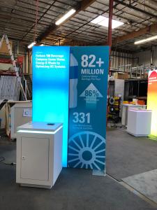 RENTAL: (1) 5 ft. Wide x 12 ft. High Double-Sided Lightbox, (2) 5 ft. Wide x 8 ft. High Double Framed Kiosks with One Backlit and One Non-Backlit, (4) RE-1575 White Laminated Counters with Recessed LED/RGB Lighting, (1) RE-1576 White Laminted Counter with