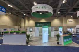 RENTAL: Island Design with Conference Room Structure @ 156" Wide x 118" Deep x 142.5" High with Gravitee System Panels and Other Extrusion Components, Framed Frosted Acrylic Window Infill Panels, Interior Door, Single-Sided Lightbox, Laminated Plant Shelv