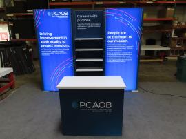 GK-1014 Gravitee Modular Inline Exhibit with Backlit Fabric Graphics, Shelves, LED Stem Light, and GOD-1558 Counter with Locking Storage