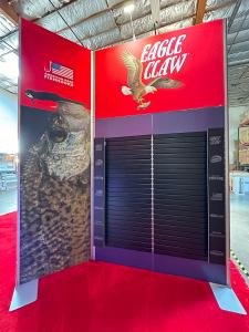 RENTAL: Island Rental Design with (3) 10' Wide x 12' High Double-Sided Gravitee System Kiosks with Black Slatwall on Both Sides -- View 5