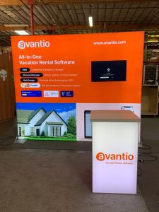 RENTAL: RE-1091 Inline Design with 114" Wide x 95" High Single-Sided Lightbox with Fabric Blocker Panel, Baseplates, Monitor Mount, 32" Monitor, RE-1566 Backlit Reception Counter, and SEG Backlit Fabric Graphics