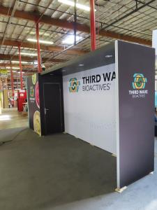 Modified Gravitee GK-2989 Modular Inline Exhibit with Tension Fabric Graphics, Locking Closet, and MOD-1724 Counter with Locking Storage -- View 3