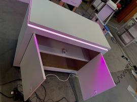 RENTAL: Modified RE-9135 Island Design with 16 ft. High Curved Gravitee Panel System Wall, (8) LED Arm Lights, RE-1576 Reception Counter with Recessed RGB Accent Lighting, and SEG Fabric Graphics -- View 3