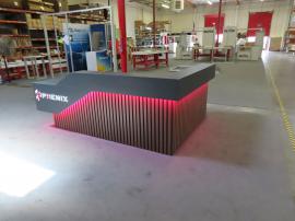 Custom Office Reception Counter with a Backlit Logo, LED Accent Lights, Shelves, Drawers, and Locking Storage -- View 2