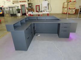 Custom Office Reception Counter with a Backlit Logo, LED Accent Lights, Shelves, Drawers, and Locking Storage -- View 3