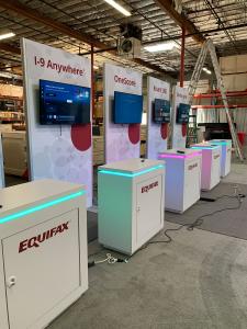 RENTAL: (5) Modified RE-1614 Double-Sided Gravitee Panel Kiosks with 46" Wide x 95" High Gravitee System Panels with End Caps, Baseplates, RE-1594 White Laminated Workstation Counters, Large Monitor Mounts, 43" Monitors, SEG Fabric Graphics, and Vinyl App