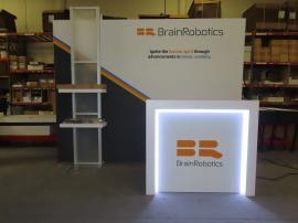 Modified ECO-1066 ecoSmart Exhibit with Fabric Graphics, (2) Shelves, Monitor Mount, LED Stem Light, and MOD-1563 Counter with LED Accent Lights and Locking Storage