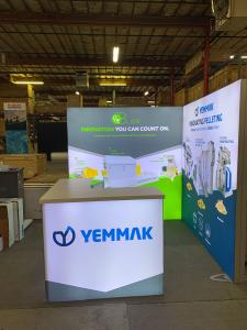 RENTAL: (2) RE-1043 Single-Sided Lightboxes Attached in L-Shape Configuration, RE-1572 L-Shaped Backlit Reception Counter, SEG Backlit Fabric Graphics -- View 2