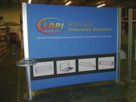 10' x 10' Visionary Designs Hybrid with Workstation and Literature Holder